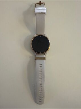 Garmin Venu Smartwatch with tan/cream Strap and rose gold Bezel